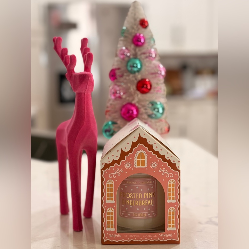 Frosted Pink Gingerbread Scented Candle on cute gingerbread house